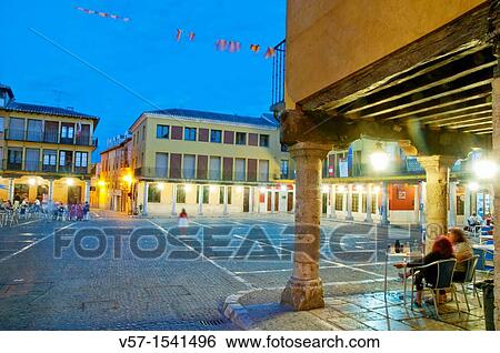 People sitting on terraces at Main Square, night view. Tordesillas, Valladolid province, Castilla Le? n, Spain. View Large Photo Image Stock Photograph - People sitting on terraces at Main Square, night view. Tordesillas, Valladolid province, Castilla Le? n, Spain.. Fotosearch