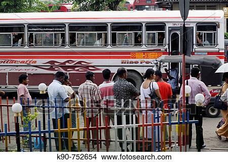 People waiting for a bus in downtown Colombo, Sri Lanka, South Asia View Large Photo Image Picture - People waiting for a bus in downtown Colombo, Sri Lanka, South Asia. Fotosearch