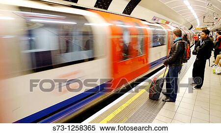 People waiting in underground. London. England. UK. View Large Photo Image Stock Photography - People waiting in underground. London. England. UK.. Fotosearch