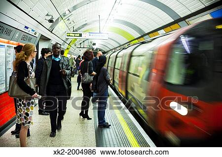 People waiting train in rush hour, London underground, UK View Large Photo Image Stock Photograph - People waiting train in rush hour, London underground, UK. Fotosearch