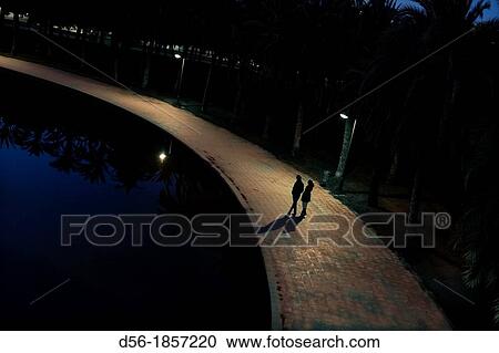 people walking at he old river bed Turia, Valencia, Spain View Large Photo Image Stock Image - people walking at he old river bed Turia, Valencia, Spain. Fotosearch