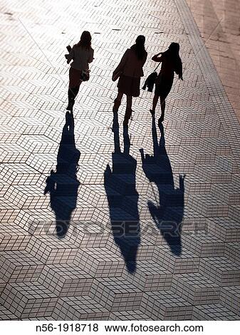 People walking at sunset View Large Photo Image Stock Photo - People walking at sunset. Fotosearch