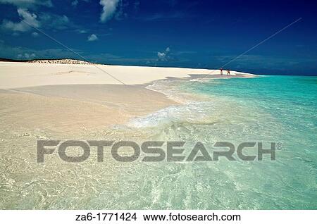 Picture - People walking in a desolate and pristine white sand beach Cayo de Agua, Los Roques National Park, Venezuela. Fotosearch