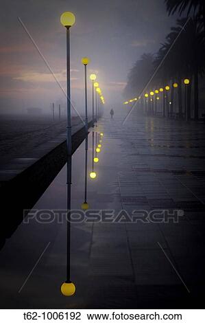 People walking in a fog late View Large Photo Image Stock Image - People walking in a fog late. Fotosearch
