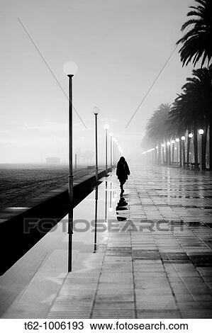 People walking in a fog late View Large Photo Image Stock Image - People walking in a fog late. Fotosearch