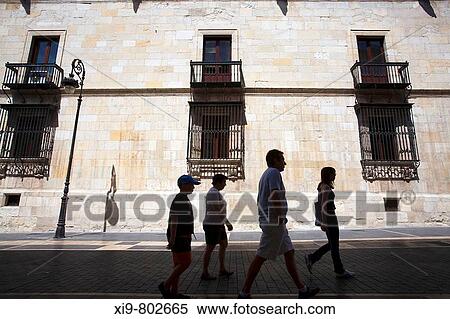 People walking in Calle Ancha in front of the South fa? ade of the Palacio de los Guzmanes, Leon. Castilla-Leon, Spain View Large Photo Image Stock Photography - People walking in Calle Ancha in front of the South fa? ade of the Palacio de los Guzmanes, Leon. Castilla-Leon, Spain. Fotosearch