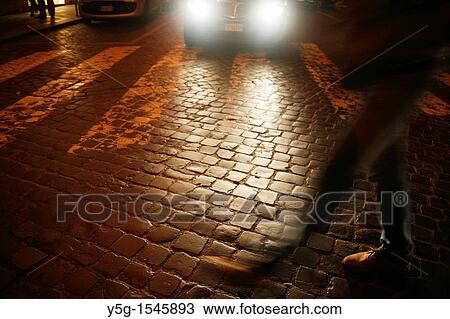 people walking in street at night View Large Photo Image Stock Image - people walking in street at night. Fotosearch