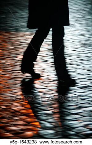 people walking in street at night View Large Photo Image Stock Photo - people walking in street at night. Fotosearch