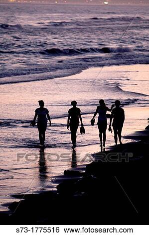 People walking in the beach, Marbella coast, MBlaga, Andalusia, Spain View Large Photo Image Stock Photograph - People walking in the beach, Marbella coast, MBlaga, Andalusia, Spain. Fotosearch