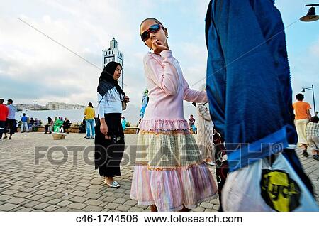 Stock Photograph - People walking on a friday afternoon Fnideq Rif region, Mediterranean coast Morocco.. Fotosearch