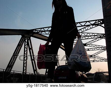 Stock Image - people walking on iron ponte dell? industria bridge in rome italy. Fotosearch