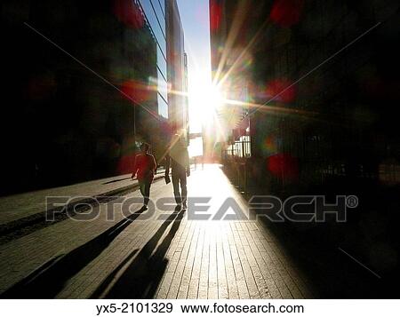 People walking on the street at More London district. View Large Photo Image Stock Photo - People walking on the street at More London district.. Fotosearch