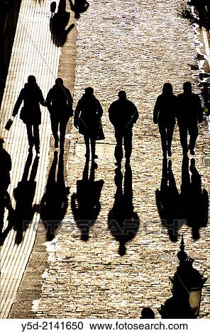 people walking paved street with long shadows, view from above, Cadiz, Andalusia, Spain View Large Photo Image Stock Image - people walking paved street with long shadows, view from above, Cadiz, Andalusia, Spain. Fotosearch