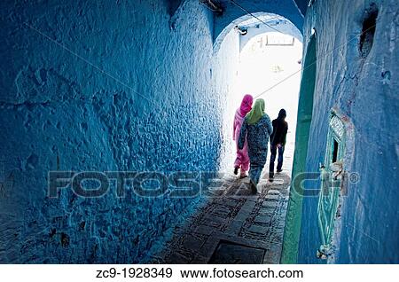 People walking through an archway in the blue medina of Chefchaouen Rif region, Morocco View Large Photo Image Stock Photo - People walking through an archway in the blue medina of Chefchaouen Rif region, Morocco. Fotosearch