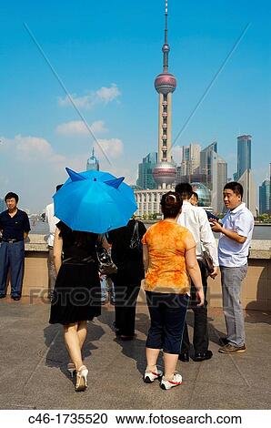 People watching Pudong skyline and Pearl tower from the Bund, Shanghai, China. View Large Photo Image Stock Image - People watching Pudong skyline and Pearl tower from the Bund, Shanghai, China.. Fotosearch