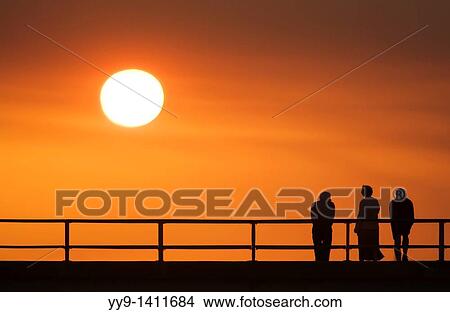 People watching sunset on pier- Jekyll Island, Georgia View Large Photo Image Picture - People watching sunset on pier- Jekyll Island, Georgia. Fotosearch