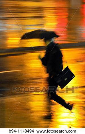 People with umbrella in a rainy day, Barcelona, Catalonia, Spain View Large Photo Image Picture - People with umbrella in a rainy day, Barcelona, Catalonia, Spain. Fotosearch