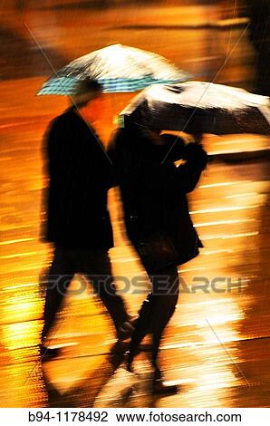 People with umbrella in a rainy day, Barcelona, Catalonia, Spain View Large Photo Image Stock Image - People with umbrella in a rainy day, Barcelona, Catalonia, Spain. Fotosearch