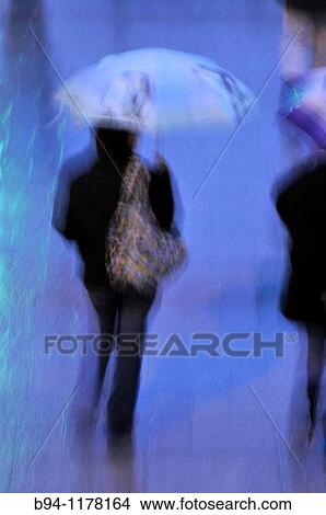 People with umbrellas in a rainy day, Barcelona, Catalonia, Spain View Large Photo Image Picture - People with umbrellas in a rainy day, Barcelona, Catalonia, Spain. Fotosearch