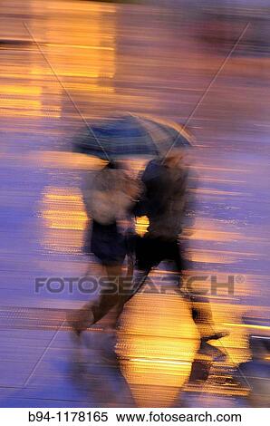 People with umbrellas in a rainy day, Barcelona, Catalonia, Spain View Large Photo Image Stock Photography - People with umbrellas in a rainy day, Barcelona, Catalonia, Spain. Fotosearch