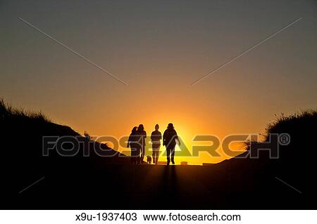 Peoples Silhouettes in front of the setting sun, Oxnard beach, California, United States of America, USA View Large Photo Image Stock Image - Peoples Silhouettes in front of the setting sun, Oxnard beach, California, United States of America, USA. Fotosearch