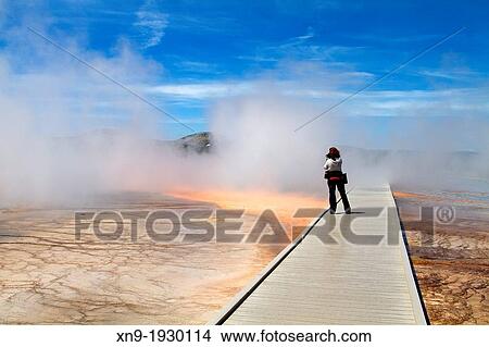 Picture - Peopletaking pictures at Grand Prismatic Spring, Midway Geyser Basin, Yellowstone National Park, Wyoming/Montana/Idaho, USA.. Fotosearch