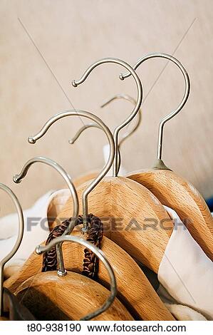 Stock Image - perchas de madera. wooden hangers.. Fotosearch