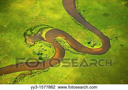 Stock Image - Pere Marquette River meandering through the estuary area on its way to Pere Marquette lake and Lake Michigan, Michigan, USA. Fotosearch