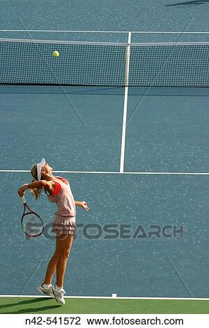 Stock Image - Perfect tennis serve technique, Dubai, United Arab Emirates. Fotosearch