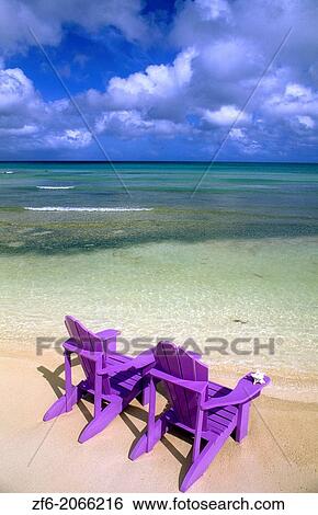 Stock Photograph - Perfect vacation Chairs on the beach.. Fotosearch