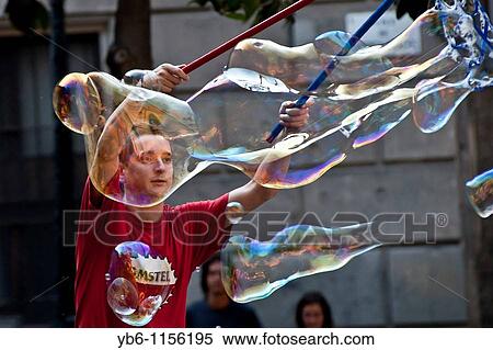 performer blowing giant soap bubbles, Barcelona, Spain View Large Photo Image Stock Photography - performer blowing giant soap bubbles, Barcelona, Spain. Fotosearch