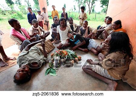 Stock Photograph - Performing naag Puja on Nagpanchami day. Baiga Tribe, Chada village, Madhya Pradesh, India.. Fotosearch