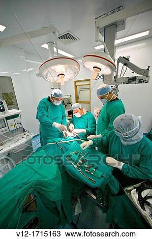 performing operation in operating room View Large Photo Image Stock Image - performing operation in operating room. Fotosearch