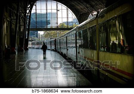 Person and train in platform in the Estacion de Francia in Barcelona View Large Photo Image Picture - Person and train in platform in the Estacion de Francia in Barcelona. Fotosearch