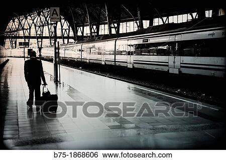 Person and train in platform in the Estacion de Francia in Barcelona View Large Photo Image Stock Photograph - Person and train in platform in the Estacion de Francia in Barcelona. Fotosearch