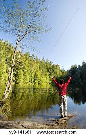 Person by lake with arms raised - Larrabee State Park, Washington View Large Photo Image Stock Image - Person by lake with arms raised - Larrabee State Park, Washington. Fotosearch