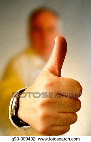 Person giving thumbs up sign View Large Photo Image Stock Image - Person giving thumbs up sign. Fotosearch
