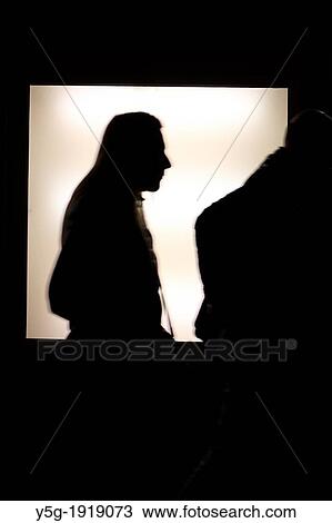 person passing neon type light fitting outside shop window at night in rome italy View Large Photo Image Stock Image - person passing neon type light fitting outside shop window at night in rome italy. Fotosearch