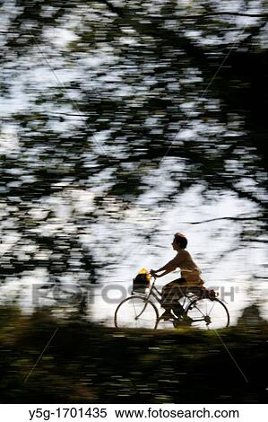 person riding fast bike on rural lane countryside View Large Photo Image Stock Photography - person riding fast bike on rural lane countryside. Fotosearch