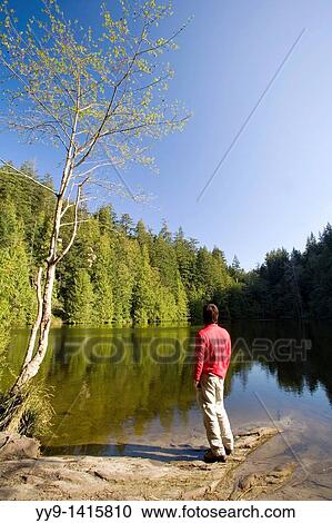 Person standing by lake - Larrabee State Park, Washington View Large Photo Image Stock Image - Person standing by lake - Larrabee State Park, Washington. Fotosearch
