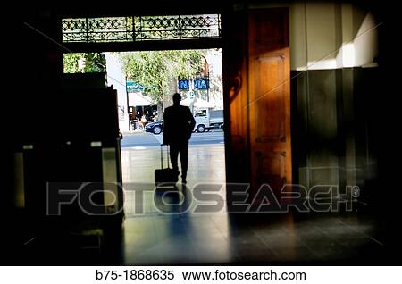 Stock Photography - Person traveling with a suitcase in Estacion de Francia, Barcelona. Fotosearch