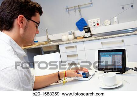 Person using a personal medicine assistant View Large Photo Image Stock Photo - Person using a personal medicine assistant. Fotosearch