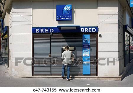 Person using ATM, Paris, France View Large Photo Image Stock Photography - Person using ATM, Paris, France. Fotosearch