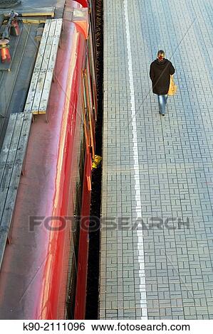 Person walking on the platform of Belarus station, Moscow, Russia, Europe. View Large Photo Image Stock Photograph - Person walking on the platform of Belarus station, Moscow, Russia, Europe.. Fotosearch