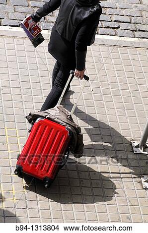 Person walking with trolley View Large Photo Image Picture - Person walking with trolley. Fotosearch