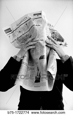 persona tapandose la cara con un periodico de economia, mercado de valores, person covering her face with a newspaper of economy, stock market, View Large Photo Image Picture - persona tapandose la cara con un periodico de economia, mercado de valores, person covering her face with a newspaper of economy, stock market,. Fotosearch