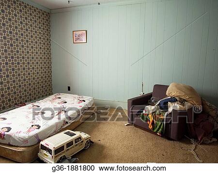 Stock Image - Personal property left behind inside a foreclosed house in Burlington, North Carolina. Fotosearch