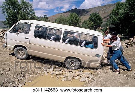 Persons push a van in Tibet View Large Photo Image Stock Image - Persons push a van in Tibet. Fotosearch