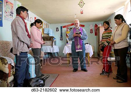PERU. Americam missionary priest giving sacrament of the sick and house blessing for the Yucra Machacha family, Jayllihuaya, Puno. View Large Photo Image Stock Image - PERU. Americam missionary priest giving sacrament of the sick and house blessing for the Yucra Machacha family, Jayllihuaya, Puno.. Fotosearch