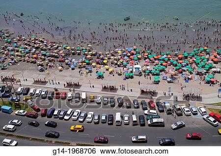 Peru, Lima, Barranco District, Malecon, Circuito de playas, Playa los Yuyos, Pacific Ocean, coast, aerial view, parking lot, car, beach, crowd, crowded, umbrella, swimming, wading, beachgoer, colorful,. View Large Photo Image Stock Photograph - Peru, Lima, Barranco District, Malecon, Circuito de playas, Playa los Yuyos, Pacific Ocean, coast, aerial view, parking lot, car, beach, crowd, crowded, umbrella, swimming, wading, beachgoer, colorful,.. Fotosearch